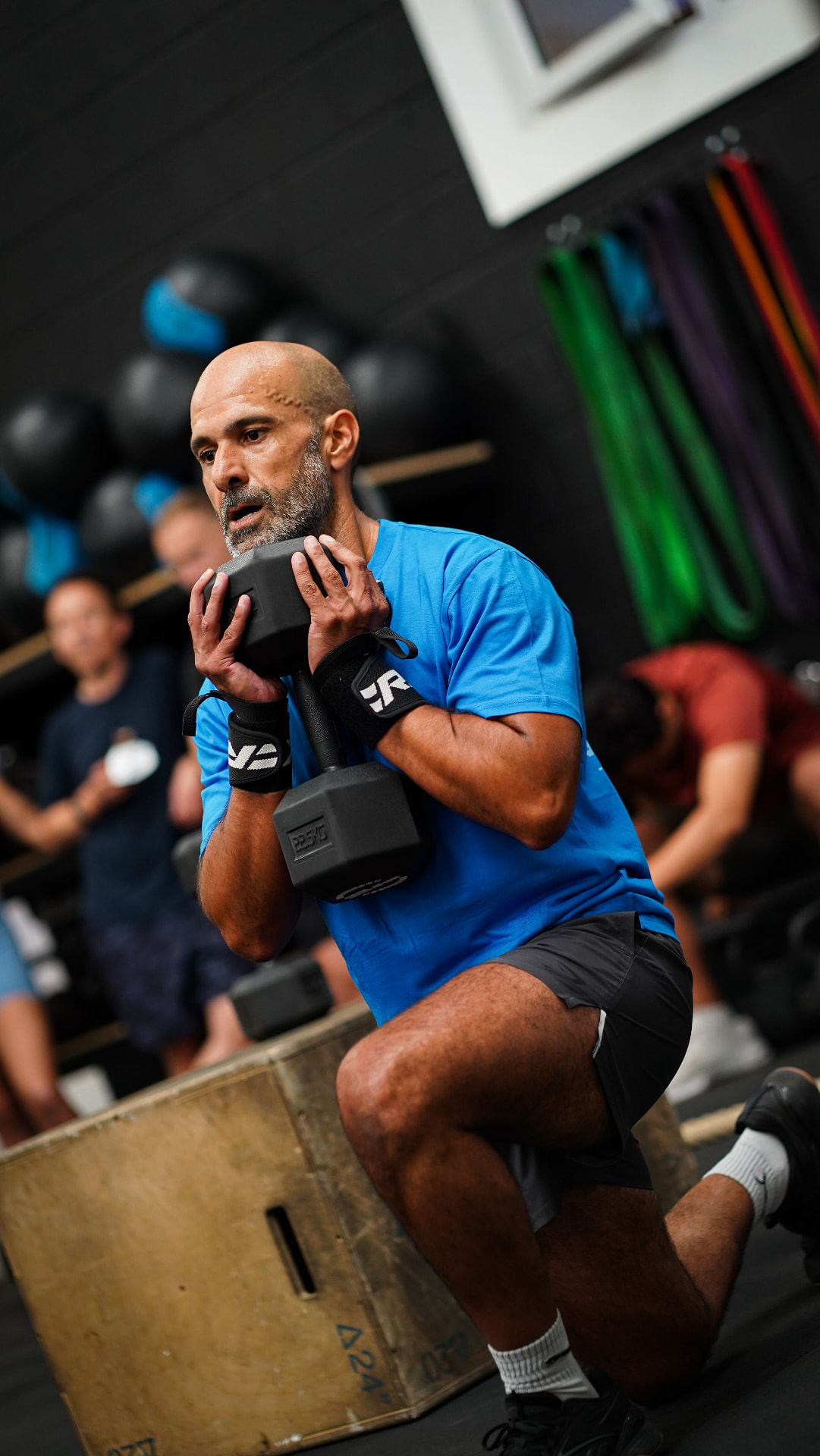 Grand Union CrossFit member performing a dumbbell lunge during a conditioning class in Berkhamsted