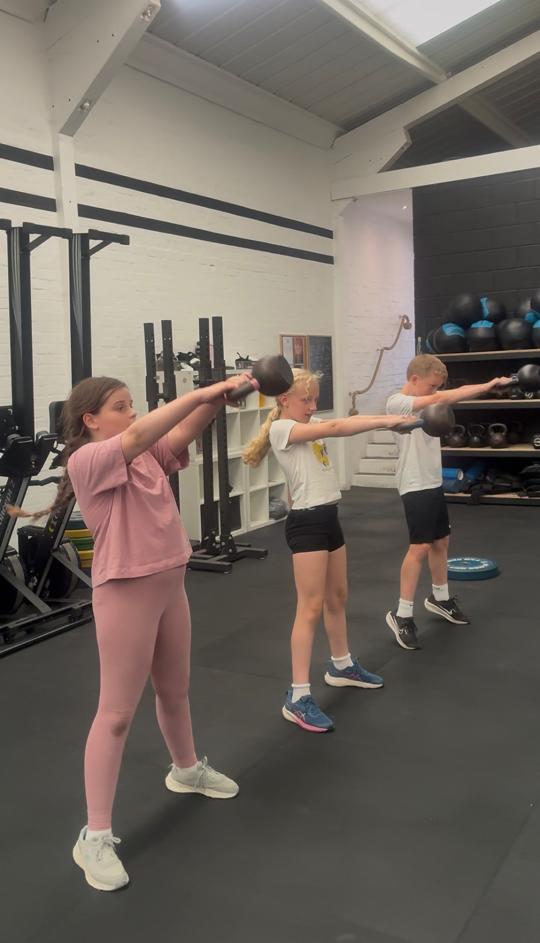 Children taking part in a coached CrossFit Kids class at Grand Union CrossFit in Berkhamsted