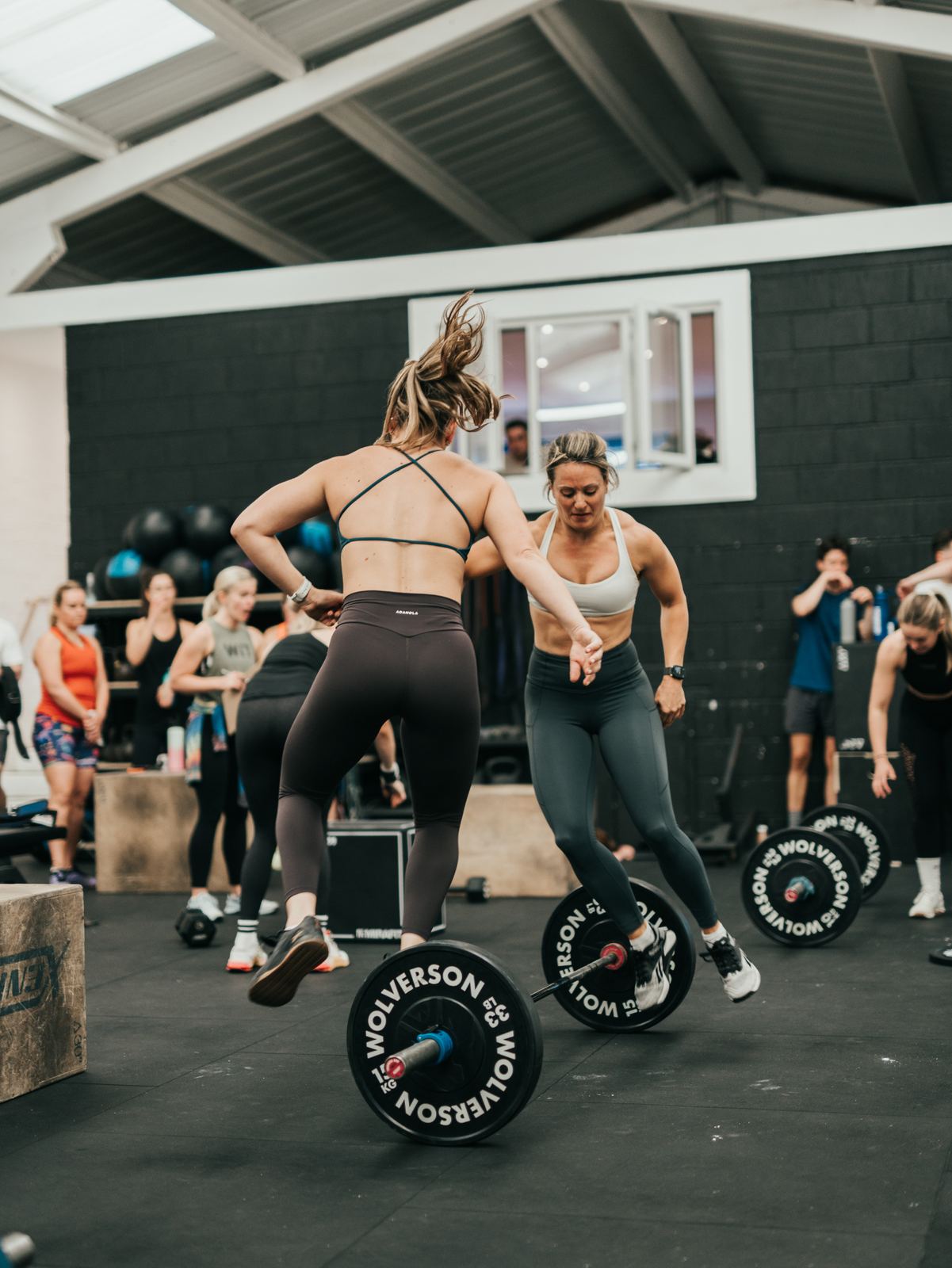 An athlete lifting a barbell during a strength session at Grand Union CrossFit